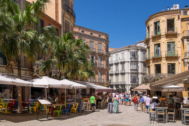 Restaurant terraces in the center of Malaga Malaga, Andalusia, Spain - July 30, 2023: Pedestrian streets lined with restaurant terraces in the urban center of the city málaga province stock pictures, royalty-free photos & images