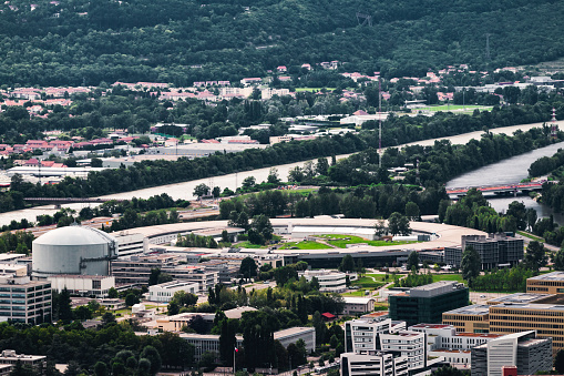 Close-up high angle view of the European Synchrotron Radiation Facility building exterior. This image was taken in Grenoble city on a cloudy summer day, in the department of Isere, Auvergne-Rhône-Alpes region in France, Europe.