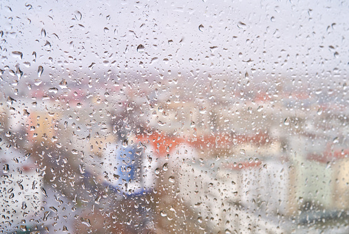 view of the city through a wet window
