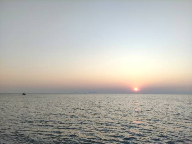 istock Sunset at Bangsaen sea on a clear day 1585569205