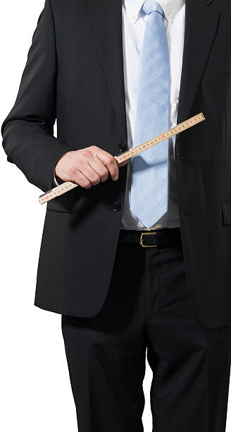 istock busninessman carrying a ruler 158556927