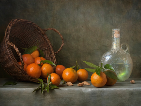 Still life with tangerines and antique bottle