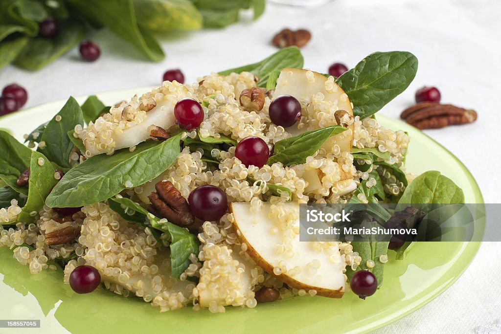 Pear salad Quinoa pear salad with spinach, cranberries and pecan Salad Stock Photo