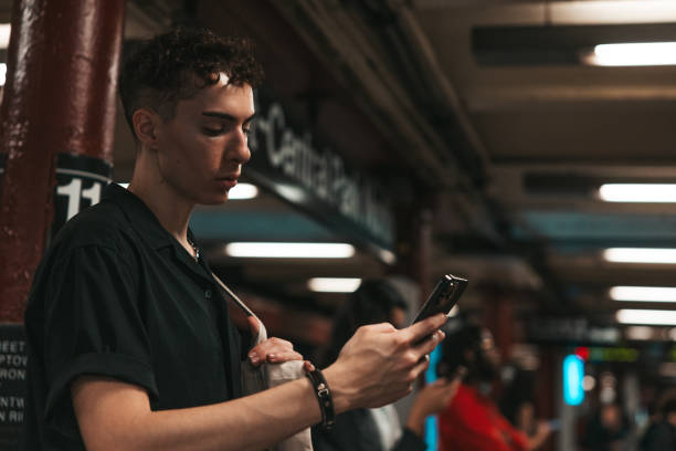 istock Young man waiting for the subway in New York 1585592902