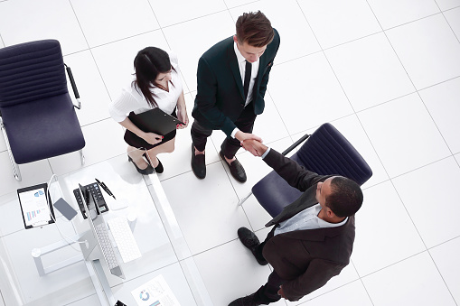 view from the top.the handshake business partners at a business meeting . the concept of cooperation.