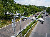 Cameras and speed control radars along a busy highway monitor and record speeding violations.