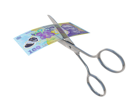 Romanian Lei bill being cut in half with scissors
