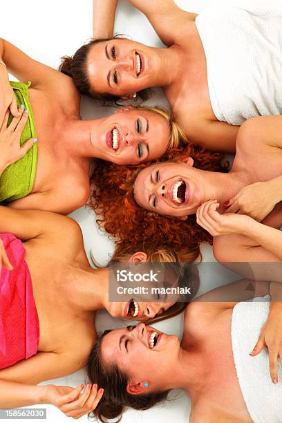 Several Girls Laying Down Together At Spa Stock Photo - Download Image Now - Women, Friendship, Group Of People