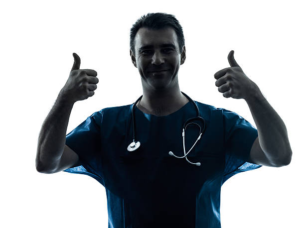 istock doctor man silhouette two thumb ups gesture portrait 158562214