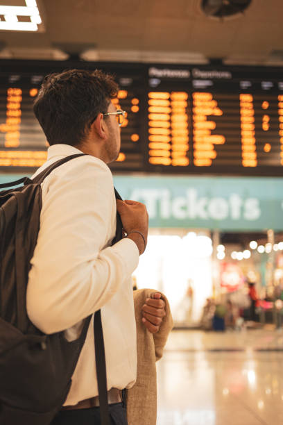 istock Millennial Indian businessman commuting for work. He is taking a train from the station . 1585631243