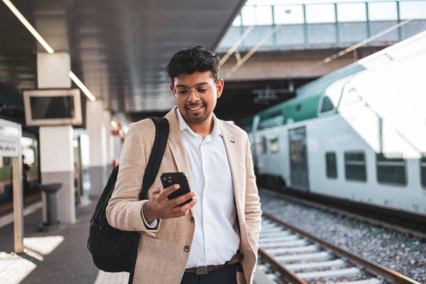 istock Millennial Indian businessman commuting for work. He is taking a train from the station . 1585632328