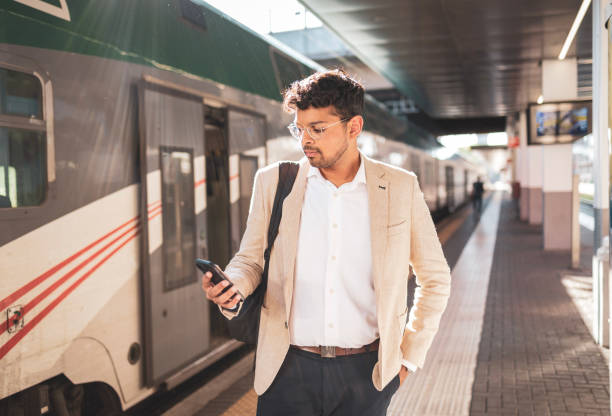 istock Millennial Indian businessman commuting for work. He is taking a train from the station . 1585634501
