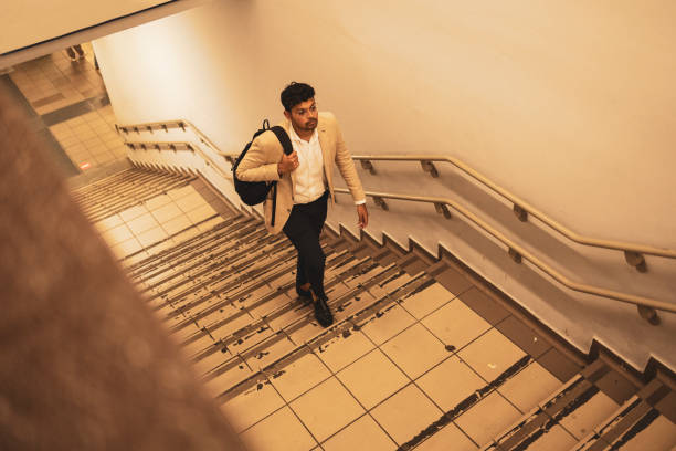 istock Millennial Indian businessman commuting for work. He is taking a train from the station . 1585642059