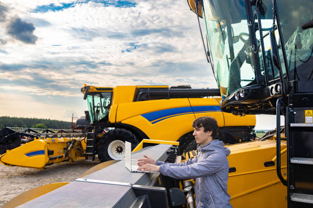 istock Engineer configures agricultural machinery 1585674594