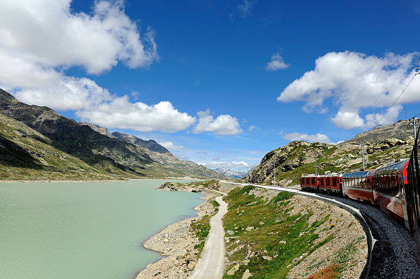 istock Mountainous landscape with bernina express passing through 158568382