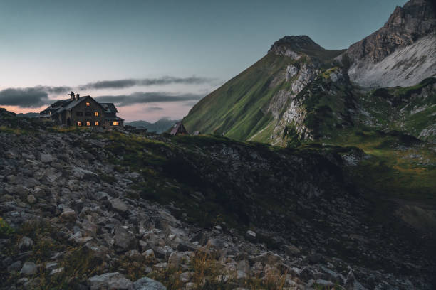 istock Sunset in the alps, with mountain hut 1585698185