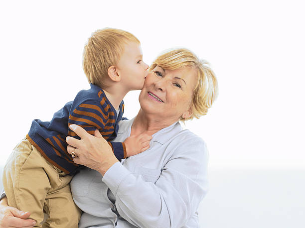 istock Grandmother getting a kiss from grandson 158570080