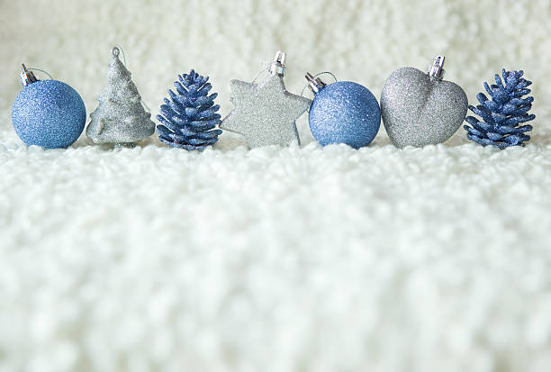 Row of silver and blue christmas decoration stock photo