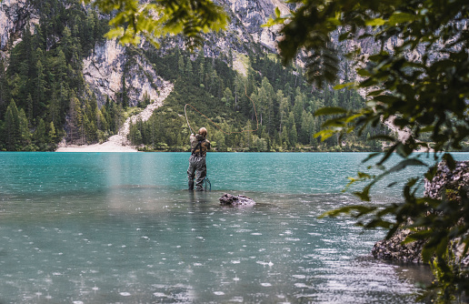 Shot of fisherman in Lago di Brains,Italy.