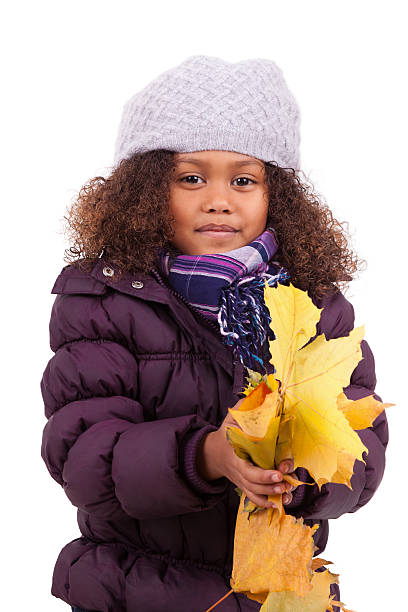 istock Little african asian girl  playing with leaf trees 158571289