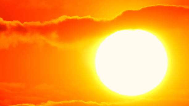 istock Red epic sunset through dark yellow orange clouds, cinematic skyline. 1585726078