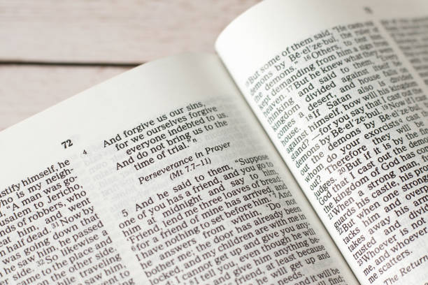 istock Perseverance in prayer, Christian verses in open holy bible book 1585747682