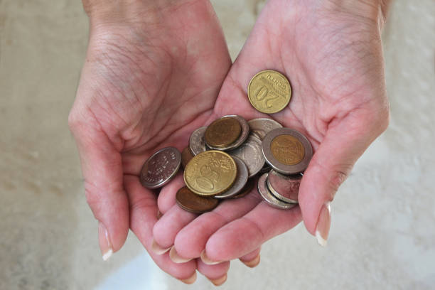 istock coins in the girl's hands 1585765252
