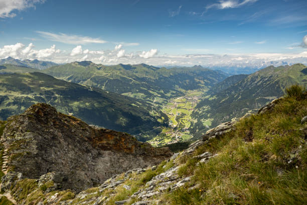 istock An impressive mountain landscape overlooking the Austrian Gastein Valley with a magnificent cloud pattern 1585775731