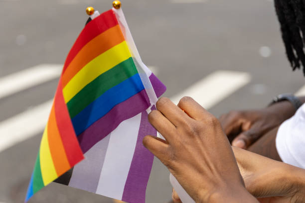 istock rainbow flag in the hands. LGBTQ concept 1585789303