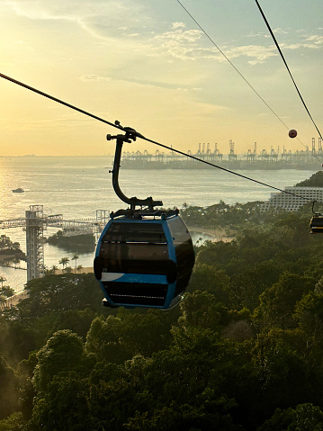 Stock photo showing close-up view of cable car gondolas and cables of the Singapore Cable Car linking Mount Faber, the HarbourFront and Sentosa Island.
