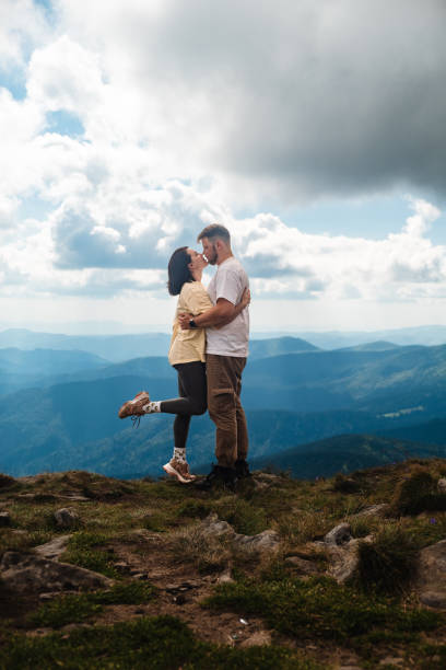 istock A couple kiss on the mountain 1585789731