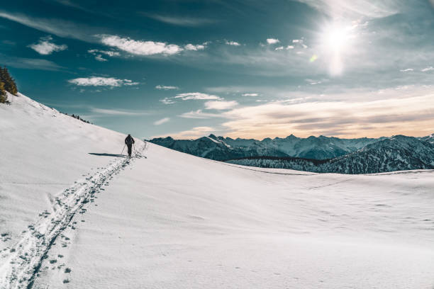 istock Hiker in the snowy mountains 1585796594