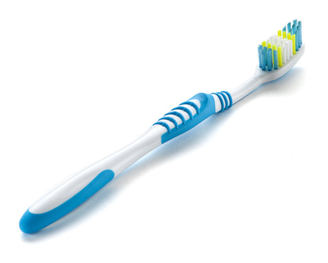 Old toothbrush isolated on the white background