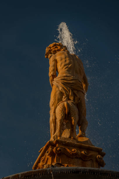 istock Historc old fountain with sunset light in summer hot evening 1585819129
