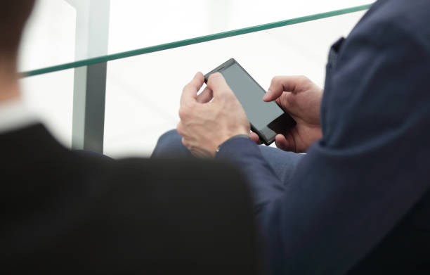 istock close up.businessman typing on a smartphone. people and technology 1585821818