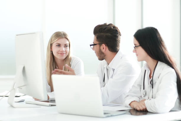 istock group of medical experts discussing online information. 1585837891