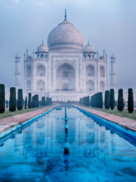 istock Reflecting Pool And Taj Mahal On A Misty Morning 1585845023