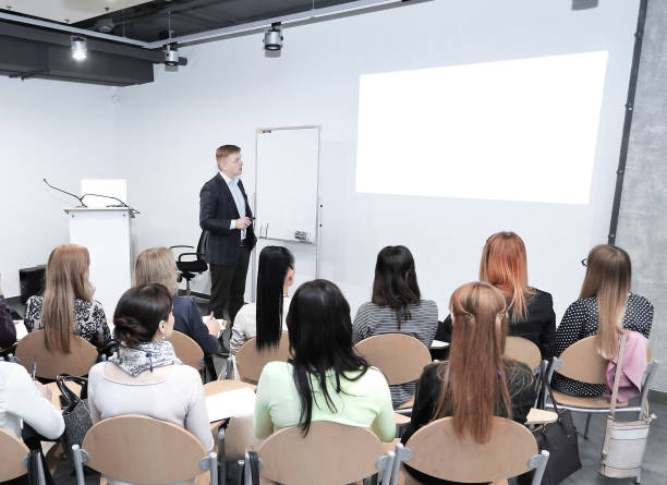 istock Manager makes a presentation to his business team 1585855358