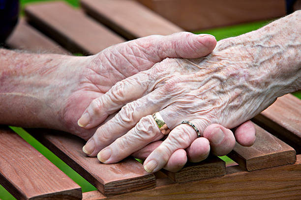 istock Elderly woman and man's hands 158587046