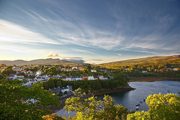 view on Portree, Isle of Skye, Scotland view on Portree with the Old Man of Storr on background, Isle of Skye, Scotland isle of skye stock pictures, royalty-free photos & images