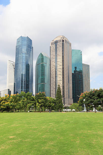 istock lawn with modern city 158588685