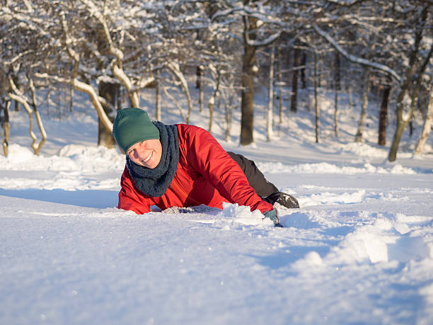 Woman playing in snow stock photo