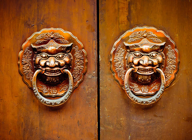 Closeup of door handle decorated with woman head for design purpose