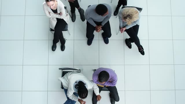 young business people chatting while sitting in a conference room. top view.