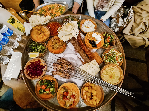 Top view of traditional Turkish foods served on a large round tray.