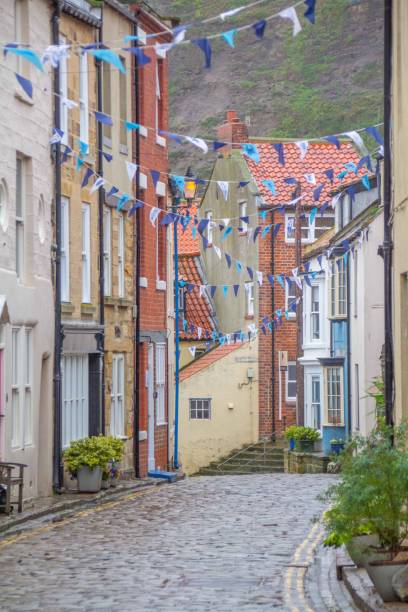 istock Road through Staithes village, Yorkshire, UK 1585977442