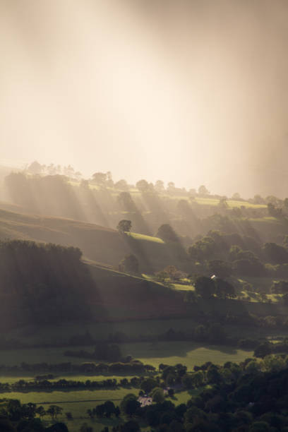 Sunbeams over the fields of Braithwaite, Lake District, Cumbria, UK