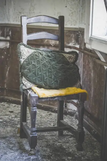 an old wooden chair in a lostplace