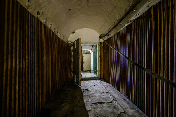 istock Old vaulted corridor of Soviet bunker, echo of Cold War 1586023384
