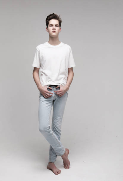 istock young man wear white t-shirt looking at camera on grey background 1586035179